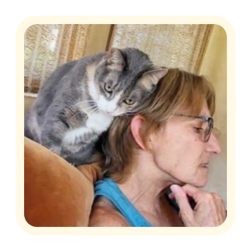 Pet sitter relaxing with a cat